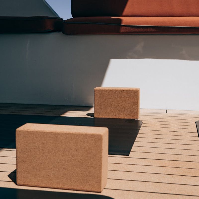 Detailed view of yoga equipment on a wooden floor