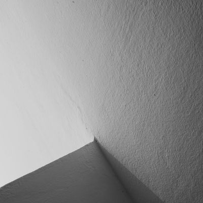 Elegant shadow play on a white wall during exercise