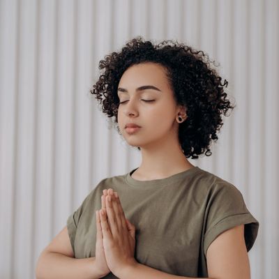 Woman hands resting in a calm meditative position